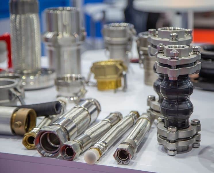 A variety of expansion joints spread out across a work bench.